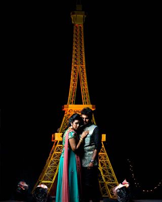 Couple doing photoshoot in front of a tower