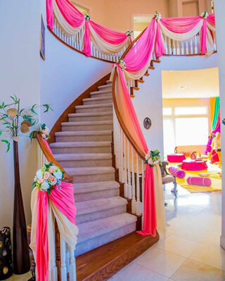 Stair Decorated by flowers and clothes for house warming party