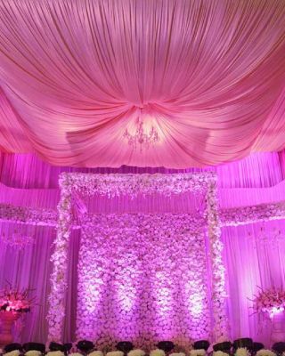 Reception Decor with white flowers and pink lights