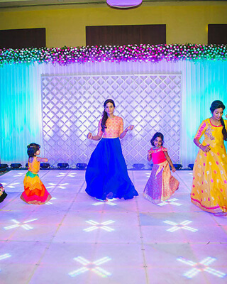 Girls dancing on stage at Sangeet night