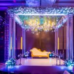 Elegant wedding Stage Decor with flowers and lights